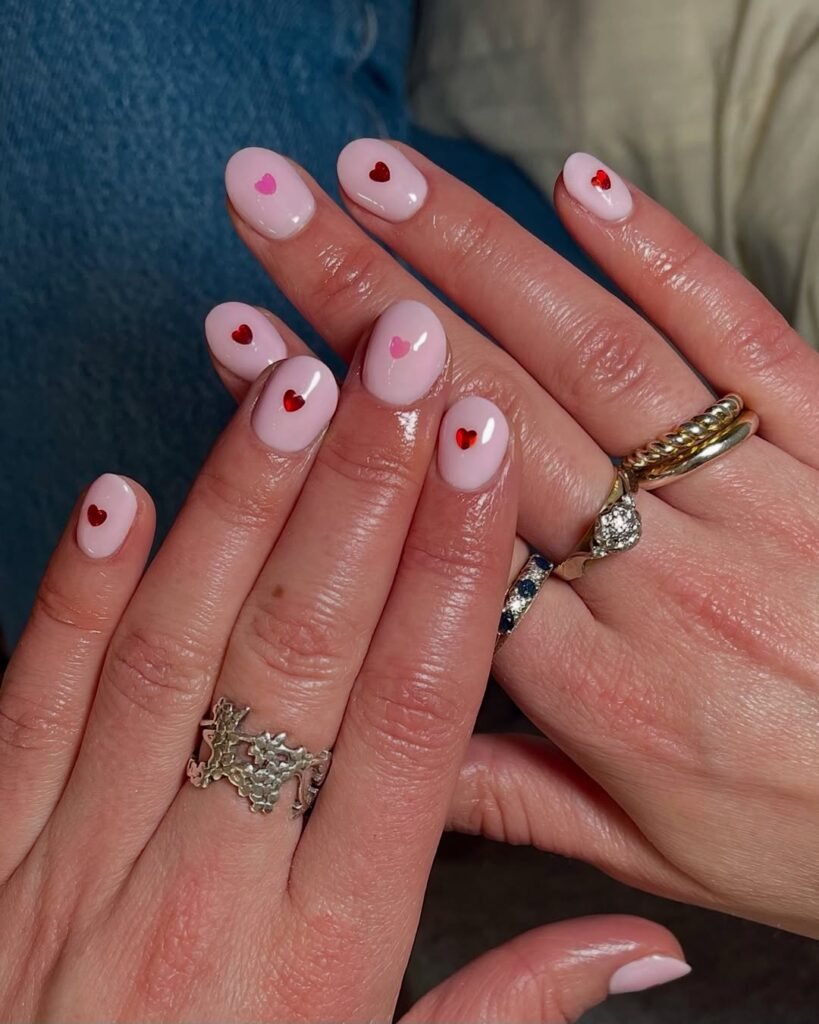 20+ Trendy February Nail Designs for Valentine's Day 2026 11 Nude with Tiny Hearts nails